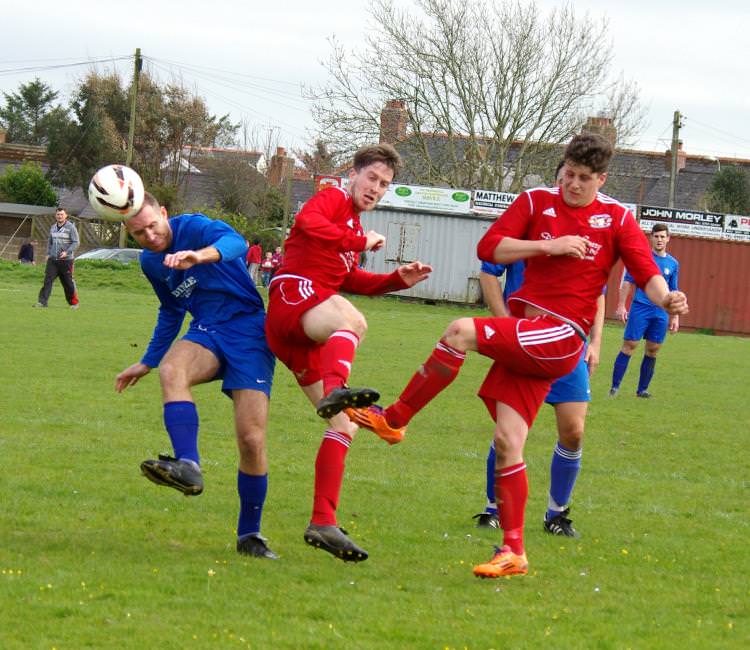 Nartberth’s Marc Hughes and Dragons’ Kieran O’Brien and Bradley Barrett play a bit of footsy.